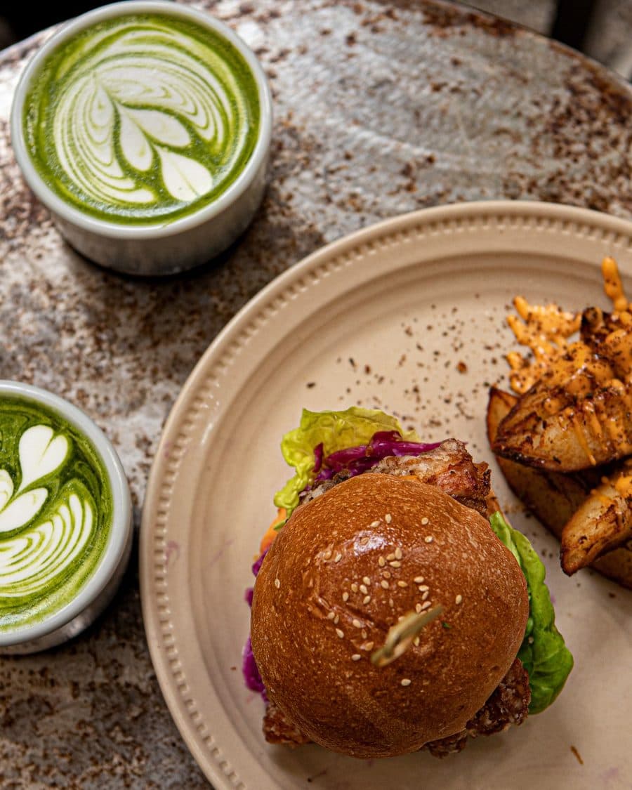 A plated burger and matcha photographed for a Malaysian restaurant