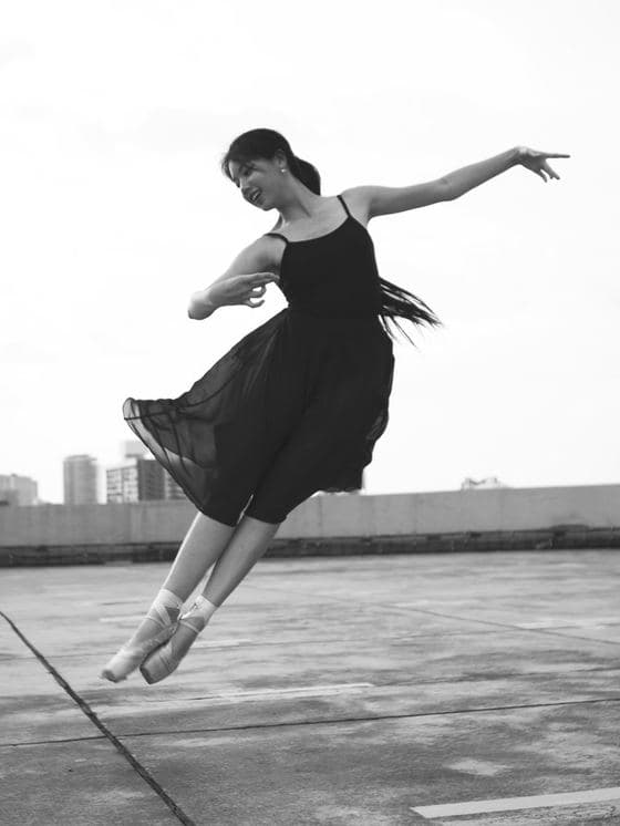 A dancer mid-movement, photographed on a Kuala Lumpur rooftop