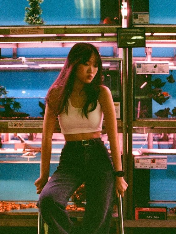 A lifestyle shot taken on location in a neon-lit Malaysian shopfront