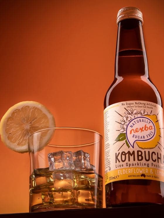 A kombucha bottle photographed on set for a Malaysian drinks brand